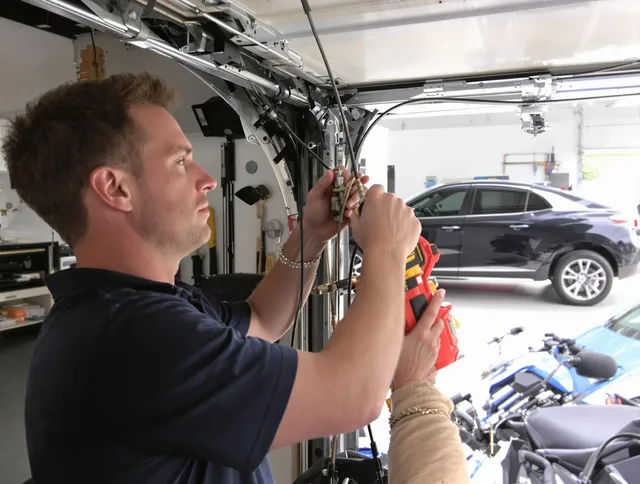 Southington Garage Door Repair safety certified technician performing cable replacement in Southington