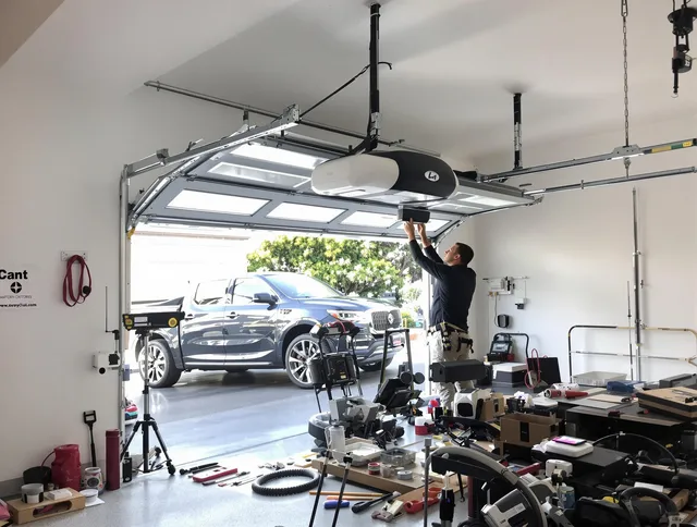 Southington Garage Door Repair specialist installing smart garage door opener system in Southington home