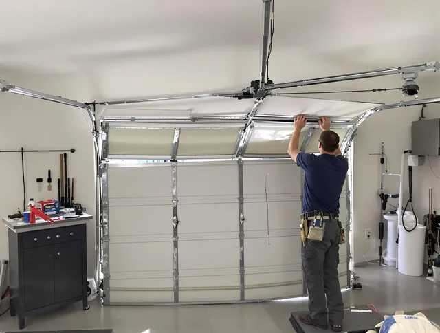Southington Garage Door Repair specialist performing precise section replacement on Southington garage door