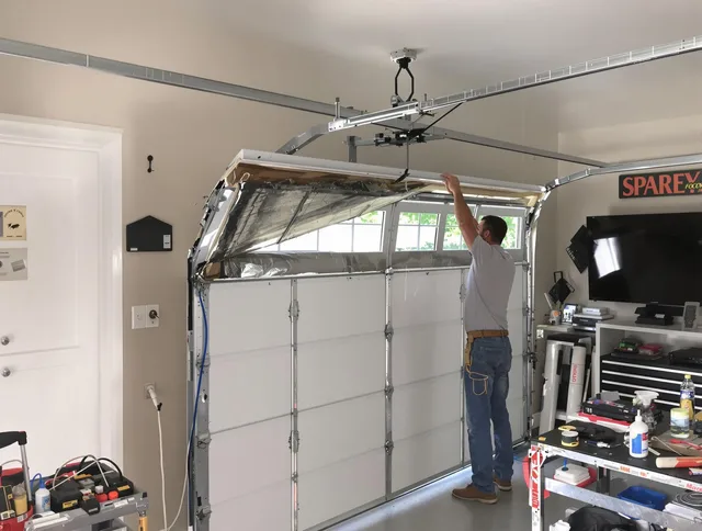 Garage door section replacement by Southington Garage Door Repair in Southington